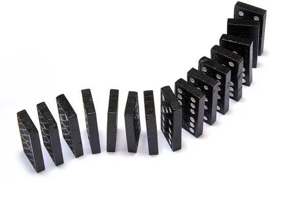 Some Black Dominos Chain White Background — Zdjęcie stockowe