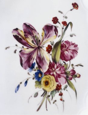 Brussels, Belgium - August 09, 2022:  Central motif of a Tournai porcelain dish decorated with a bouquet of flowers