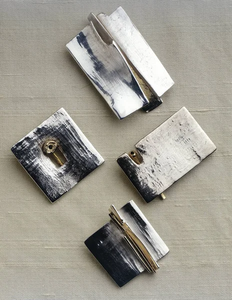 Set Four Modern Stylish Platinum Brooch Jewelry Textured Background — Zdjęcie stockowe