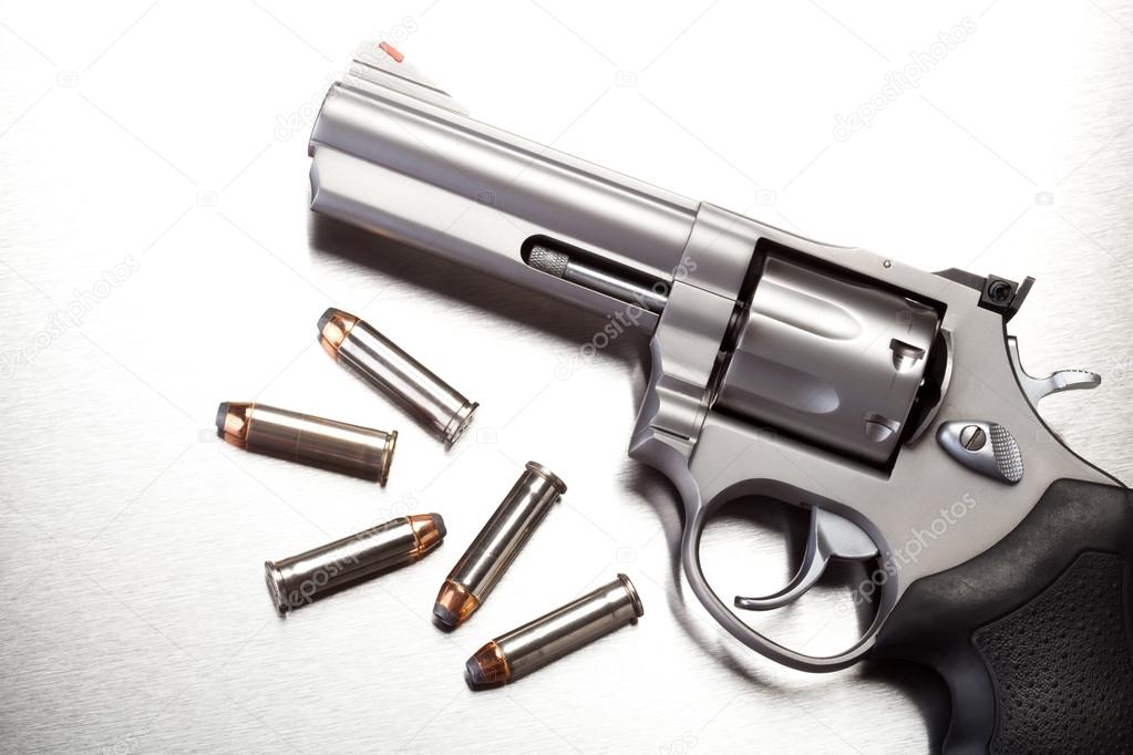 gun with bullets on steel