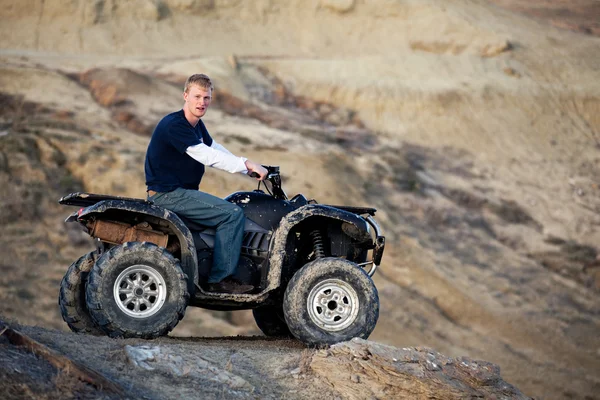 Teen on quad ATV in the hills — Stock Photo, Image