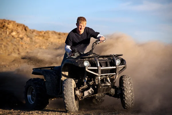 Teenager riding quad — Stock Photo, Image