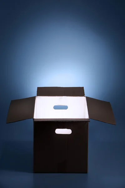 Glowing light from open box — Stock Photo, Image