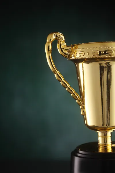 Trophy cup isolated on the green board — Stock Photo, Image