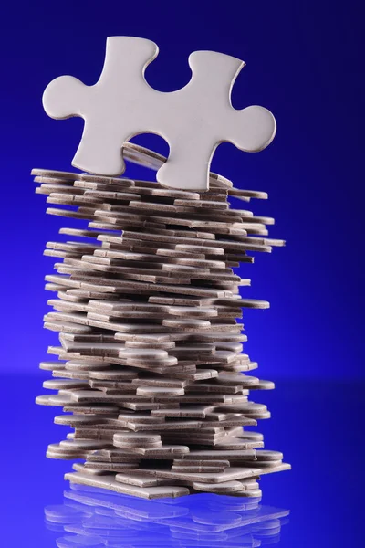 Stack of jigsaw puzzle pieces — Stock Photo, Image