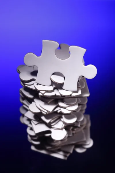 Stack of jigsaw puzzle pieces — Stock Photo, Image