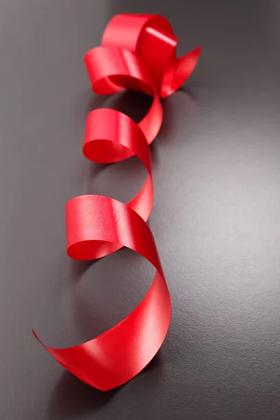 Curled red ribbon — Stock Photo, Image
