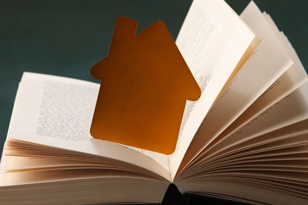 Golden house and book — Stock Photo, Image