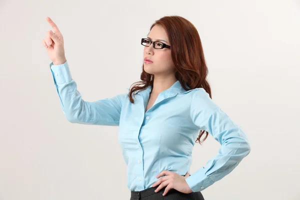 Businesswoman using large transparent touch screen — Stock Photo, Image