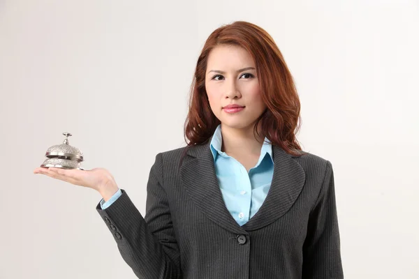 Woman holding a desk bell — Stock Photo, Image