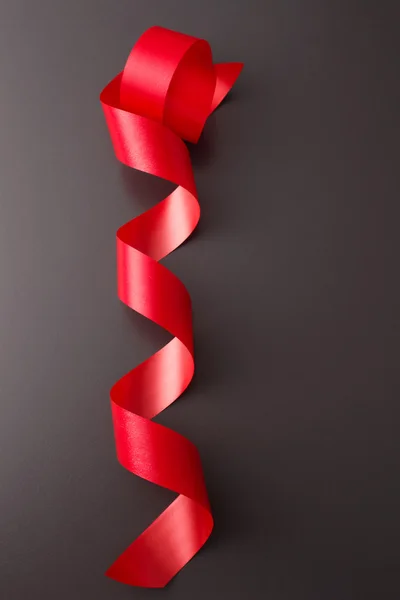 Curled red ribbon — Stock Photo, Image