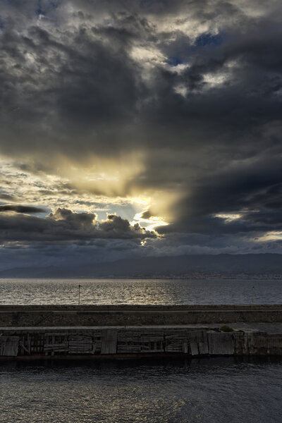 Italy, Calabria, Villa S. Giovanni, view of the Sicily Channel and the sicilian coastline at sunset