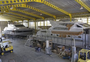 Luxury yachts under construction clipart