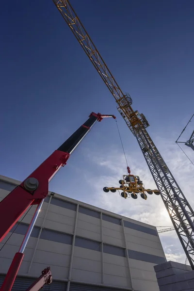 Tower cranes, glass holder — Stock Photo, Image