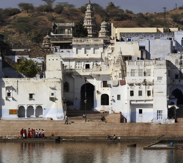 Indian pilgrims take a bath in the sacred lake — Stok fotoğraf