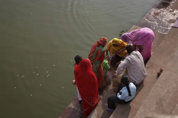 Indian pilgrims take a bath in the sacred lake — Stok fotoğraf