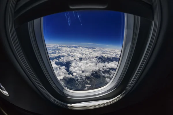 Aerial view of clouds from an airplane window — Stock Photo, Image