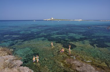 Italy, Sicily, Portopalo - people taking a bath n the sea clipart