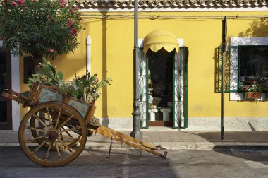 Italy, Sicily, Portopalo, old wooden sicilian cart with prickly pears clipart