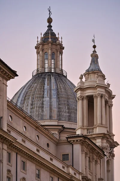 Italy, Lazio, Rome, Navona Square, view of the baroque Sant 'Agnese in Agone Church bell tower at sunset — стоковое фото
