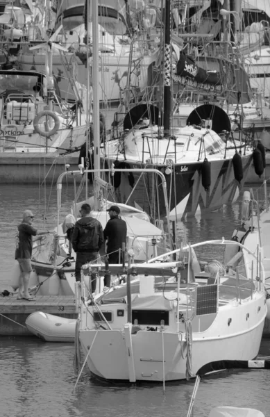 Stock image Italy, Sicily, Mediterranean sea, Marina di Ragusa (Ragusa Province); 16 April 2022, people and sailing boats in the port - EDITORIAL