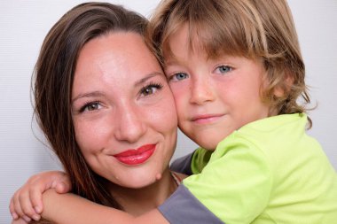 Italy, Sicily, Marina di Ragusa (Ragusa Province); portrait of a mother with her 6 years old male son