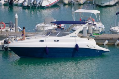 Italy, Sicily, Mediterranean Sea, Marina di Ragusa (Ragusa Province); 21 July 2022, people on a luxury yacht in the port - EDITORIAL