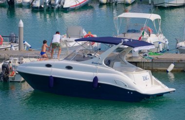 Italy, Sicily, Mediterranean Sea, Marina di Ragusa (Ragusa Province); 21 July 2022, people on a luxury yacht in the port - EDITORIAL