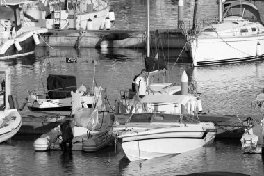 Italy, Sicily, Mediterranean sea, Marina di Ragusa (Ragusa Province); 2 August 2022, people, motor boats and luxury yachts in the port - EDITORIAL