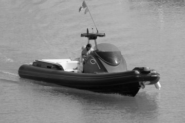 Italy, Sicily, Mediterranean Sea, Marina di Ragusa (Ragusa Province); 3 August 2022, men on a big rubber boat in the port - EDITORIAL