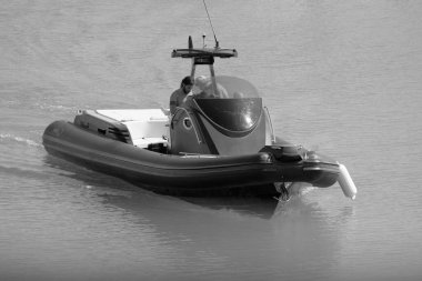 Italy, Sicily, Mediterranean Sea, Marina di Ragusa (Ragusa Province); 3 August 2022, men on a big rubber boat in the port - EDITORIAL