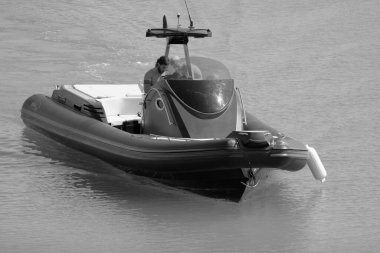 Italy, Sicily, Mediterranean Sea, Marina di Ragusa (Ragusa Province); 3 August 2022, men on a big rubber boat in the port - EDITORIAL