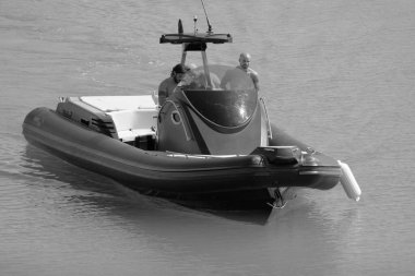 Italy, Sicily, Mediterranean Sea, Marina di Ragusa (Ragusa Province); 3 August 2022, men on a big rubber boat in the port - EDITORIAL