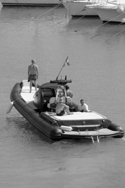 Italy, Sicily, Mediterranean Sea, Marina di Ragusa (Ragusa Province); 3 August 2022, men on a big rubber boat in the port - EDITORIAL