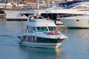 Italy, Sicily, Mediterranean Sea, Marina di Ragusa (Ragusa Province); 7 August 2022, people on a luxury yacht in the port - EDITORIAL