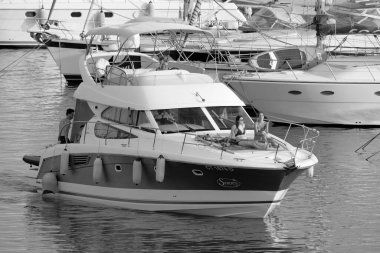 Italy, Sicily, Mediterranean Sea, Marina di Ragusa (Ragusa Province); 7 August 2022, people on a luxury yacht in the port - EDITORIAL