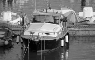 Italy, Sicily, Mediterranean Sea, Marina di Ragusa (Ragusa Province); 11 August 2022, men on a luxury yacht in the port - EDITORIAL