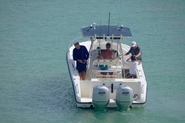 Italy, Sicily, Mediterranean Sea, Marina di Ragusa (Ragusa Province); 16 August 2022, sport fishermen on a motor boat in the port - EDITORIAL