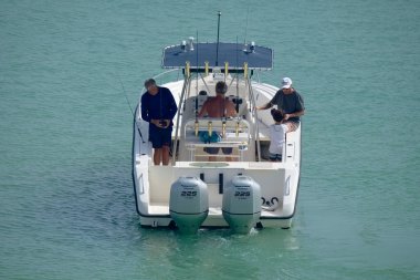 Italy, Sicily, Mediterranean Sea, Marina di Ragusa (Ragusa Province); 16 August 2022, sport fishermen on a motor boat in the port - EDITORIAL