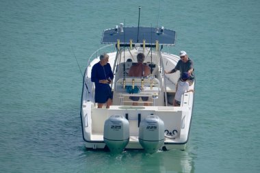 Italy, Sicily, Mediterranean Sea, Marina di Ragusa (Ragusa Province); 16 August 2022, sport fishermen on a motor boat in the port - EDITORIAL