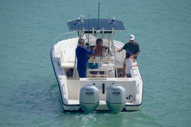 Italy, Sicily, Mediterranean Sea, Marina di Ragusa (Ragusa Province); 16 August 2022, sport fishermen on a motor boat in the port - EDITORIAL