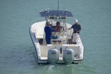 Italy, Sicily, Mediterranean Sea, Marina di Ragusa (Ragusa Province); 16 August 2022, sport fishermen on a motor boat in the port - EDITORIAL