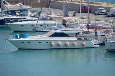 Italy, Sicily, Mediterranean Sea, Marina di Ragusa (Ragusa Province); 16 August 2022, men on a luxury yacht in the port - EDITORIAL