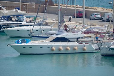 Italy, Sicily, Mediterranean Sea, Marina di Ragusa (Ragusa Province); 16 August 2022, men on a luxury yacht in the port - EDITORIAL