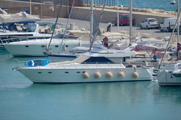 Italy, Sicily, Mediterranean Sea, Marina di Ragusa (Ragusa Province); 16 August 2022, men on a luxury yacht in the port - EDITORIAL