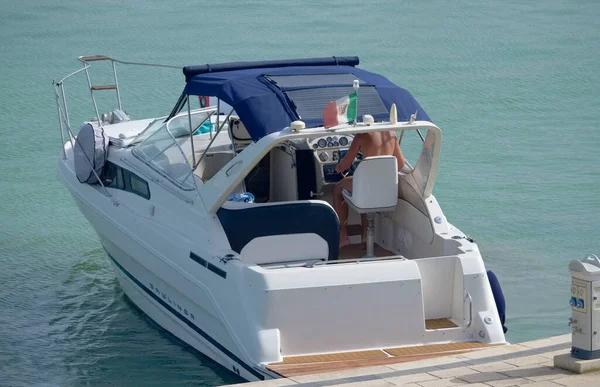 Italy, Sicily, Mediterranean Sea, Marina di Ragusa (Ragusa Province); 16 August 2022, man on a luxury yacht in the port - EDITORIAL