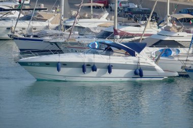 Italy, Sicily, Mediterranean Sea, Marina di Ragusa (Ragusa Province); 17 August 2022, people on a luxury yacht in the port - EDITORIAL