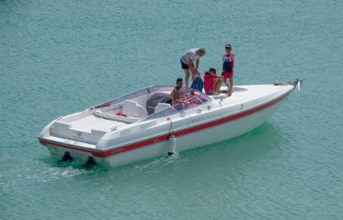 Italy, Sicily, Mediterranean Sea, Marina di Ragusa (Ragusa Province); 22 August 2022, people on a luxury yacht in the port - EDITORIAL