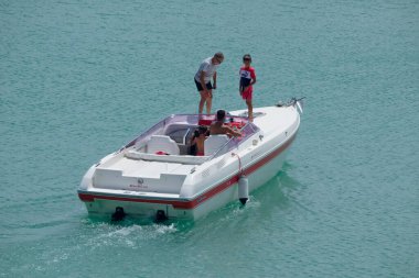 Italy, Sicily, Mediterranean Sea, Marina di Ragusa (Ragusa Province); 22 August 2022, people on a luxury yacht in the port - EDITORIAL