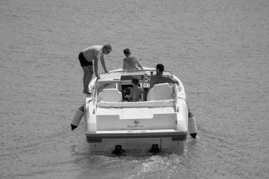 Italy, Sicily, Mediterranean Sea, Marina di Ragusa (Ragusa Province); 22 August 2022, people on a luxury yacht in the port - EDITORIAL